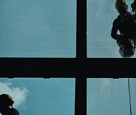 a man and woman looking out a window_edi