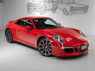 Glossy red Porsche 911 Carrera displayed indoors after professional detailing, illustrating how often to get car detailing for The Detailing Specialists.
