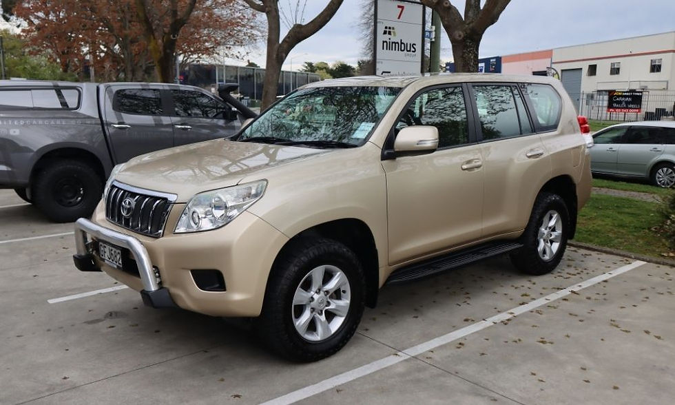 Front and side view of a beige Toyota Land Cruiser with a spotless exterior after professional detailing, parked outdoors to highlight its enhanced resale-ready appearance.