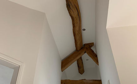Painted ceiling with exposed beam