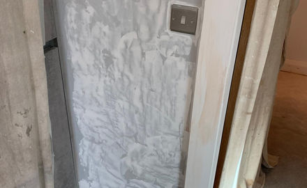 Applying grey topcoat to walls