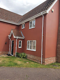 front view of a house painted brown
