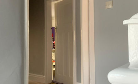 Hallways with grey walls and white detailing