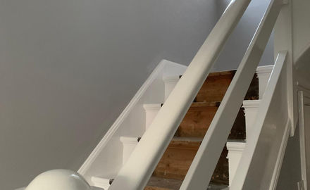 Stairs with painted bannisters