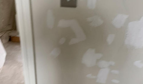 Wall after wallpaper has been stripped