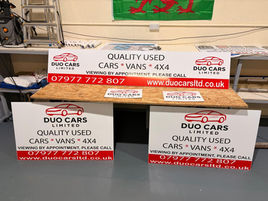 Promotional sign for quality used cars