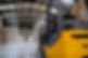 Back view of forklift in warehouse in the middle of stored goods