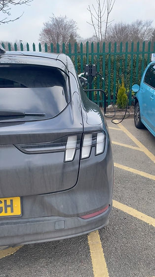 vehicle being charged with EV charger