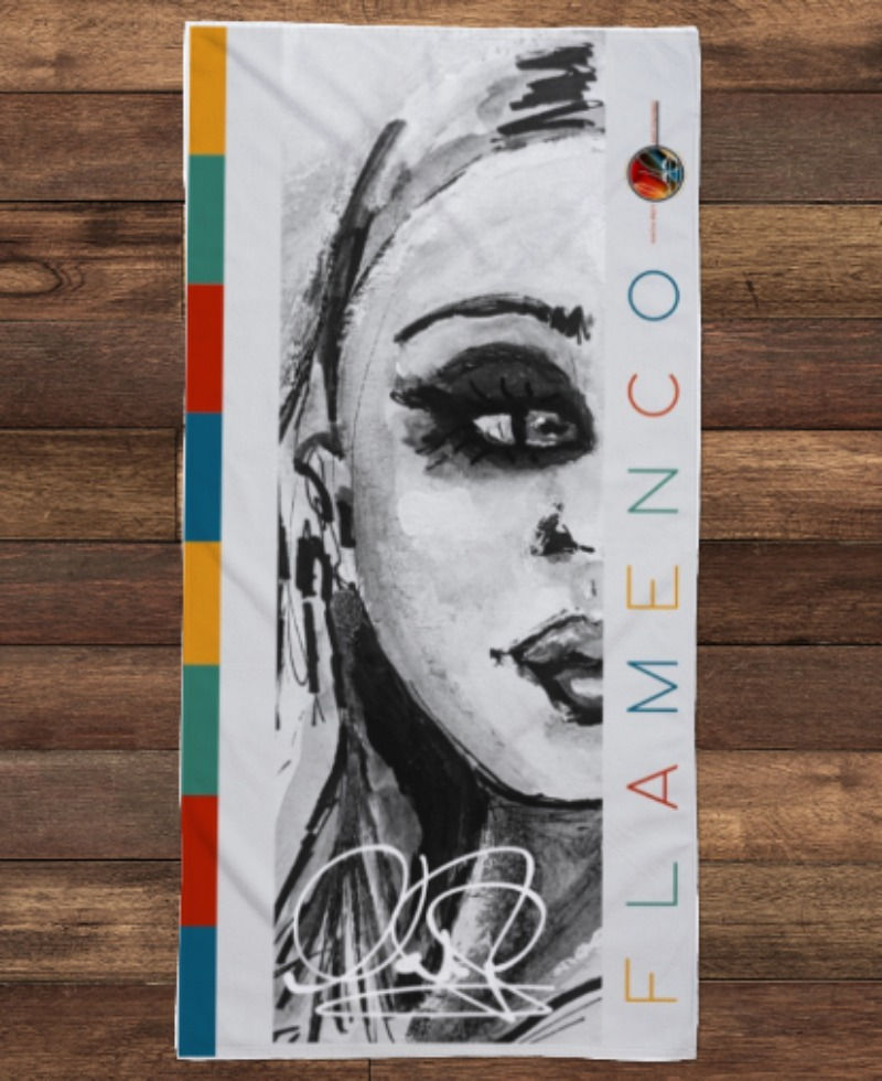 serviette de plage Flamenco sur un quai de bois