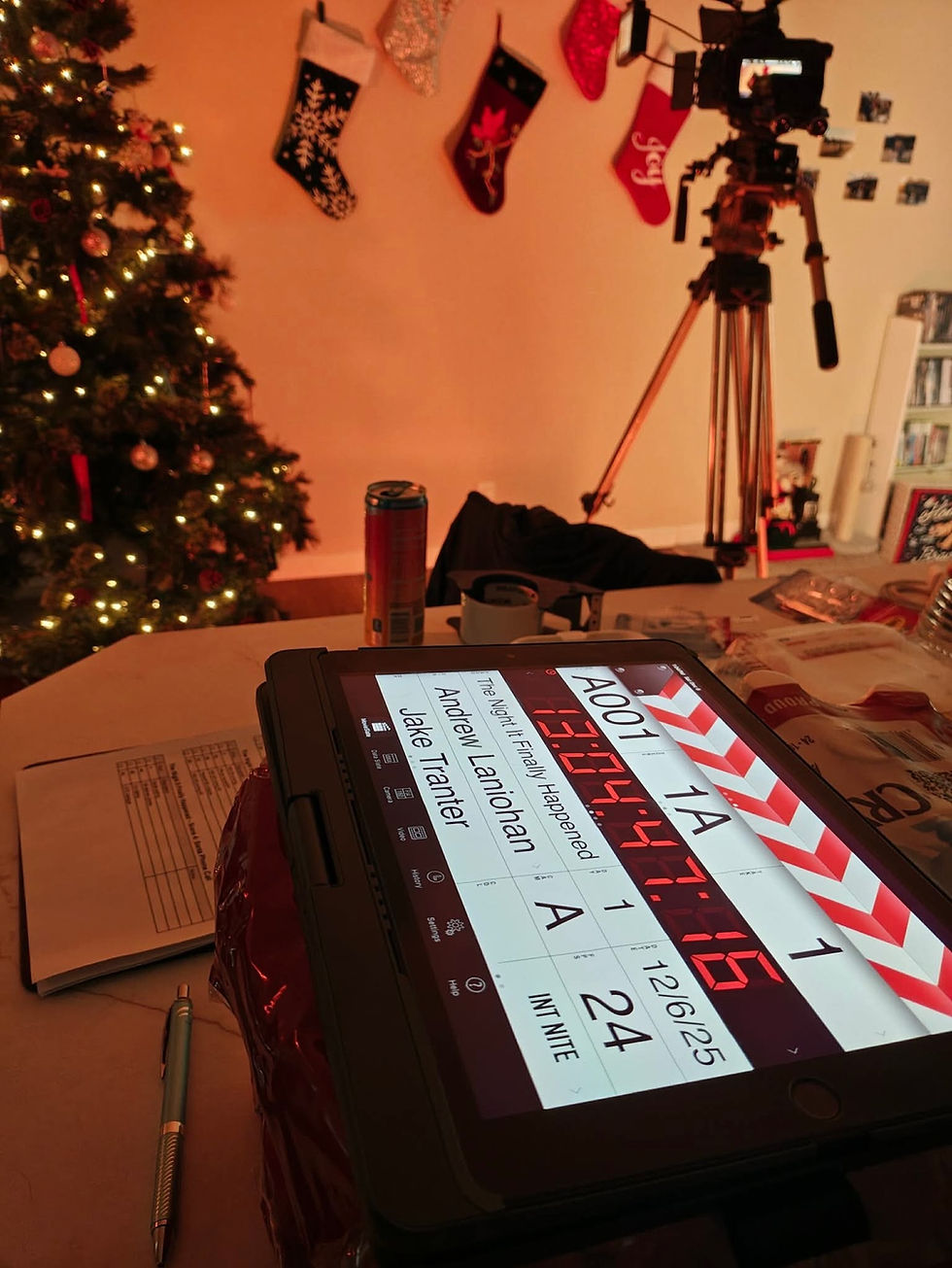 Close-up view of a film clapperboard on a rustic wooden table