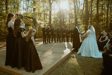 Wedding Ceremony with sun setting through the woods at the Burch on twenty seven wedding venue in Harris Couty Georgia near atlanta ga, wedding venue near columbus, ga , wedding venue near lagrange ga, wedding venue near phenix city alabama