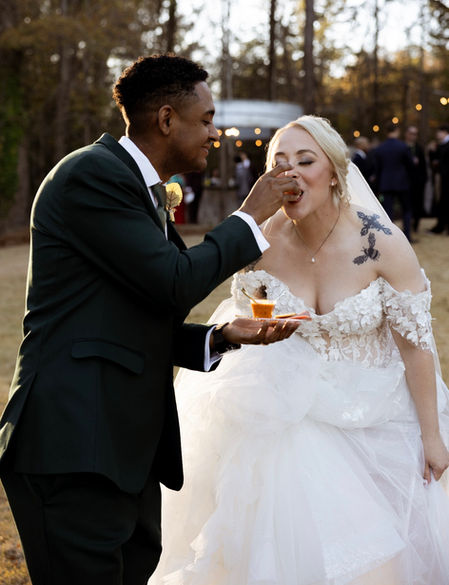 Groom feeding Bride y Seven  at the Burch on twenty seven wedding venue in Harris Couty Georgia near atlanta ga, wedding venue near columbus, ga , wedding venue near lagrange ga, wedding venue near phenix city alabama