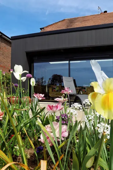 External house extension featuring large sliding glass doors completed by Green Manor Building Ltd in Chailey, East Sussex
