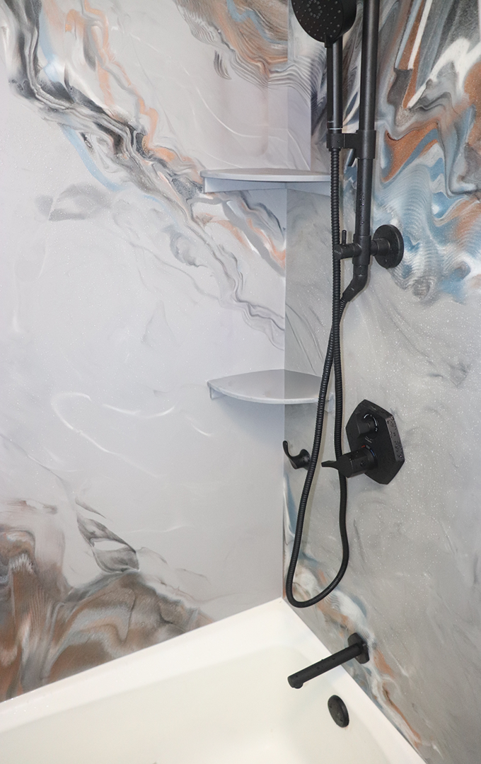 "Beyond Surfaces custom epoxy shower wall panel installation"
