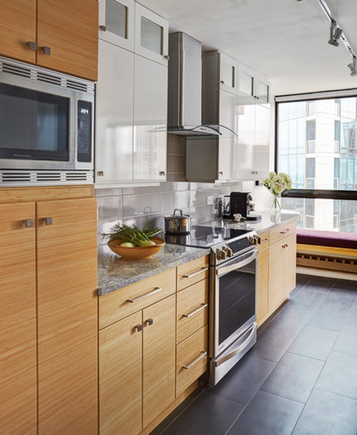 "Downtown Chicago condo kitchen remodel with white upper cabinets and bamboo base cabinets"