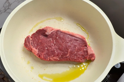 Raw steak on the fry pan 