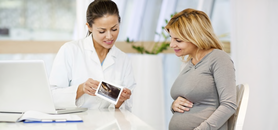 Pregnant woman with her Gynecologist._97391.png
