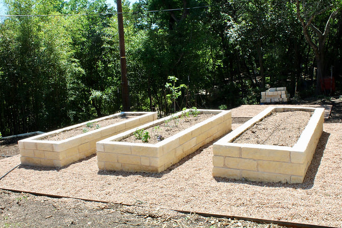 This client came to us with a design by another designer as well as a bamboo and slope problem. We decided to remove the bamboo from the back yard and correct the slope with a retaining wall. Next, we installed three limestone raised beds for veggie gardening, several fruit trees lining the property line and gravel areas around the veggie garden. We addressed some flooding issues around the entry by excavating for positive water flow and allowing for a rain garden.