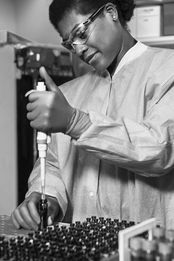a woman scientist doing lab work