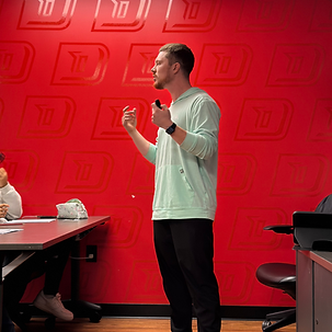 Coach Evyn helping athletes strengthen mindset and leadership through mental performance coaching session