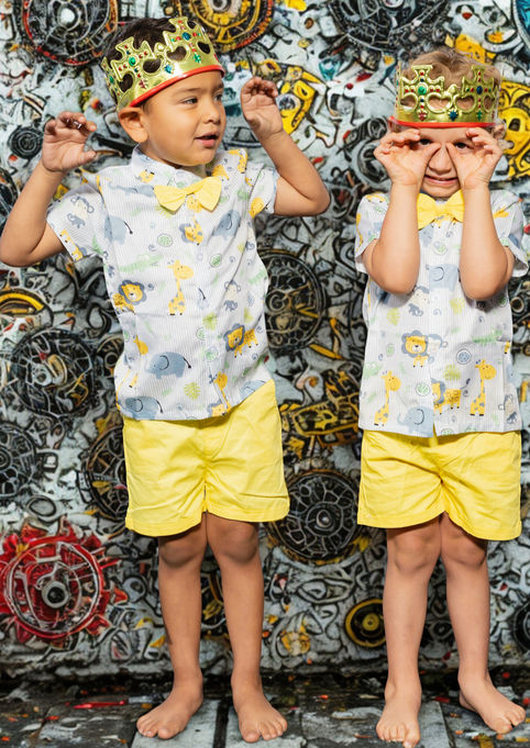 Two beginner child dancers dressed up in dance costumes.