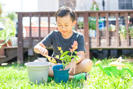 IMG_4539-Kid-Planting-With-Plastic-Pots.jpeg