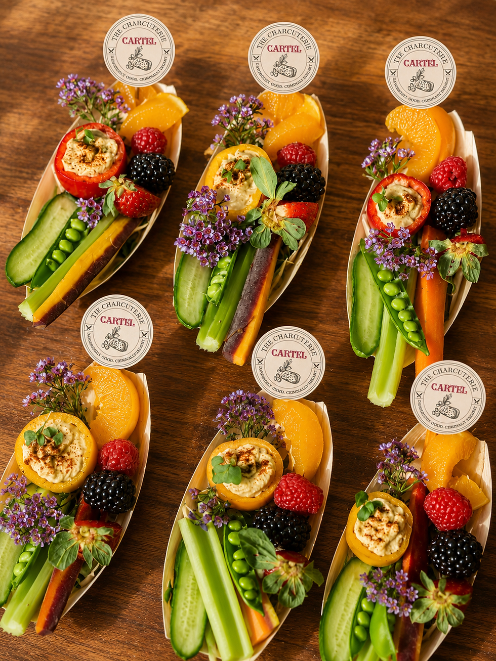 Artisan charcuterie board featuring premium cheeses, cured meats, fruits and gourmet accompaniments.