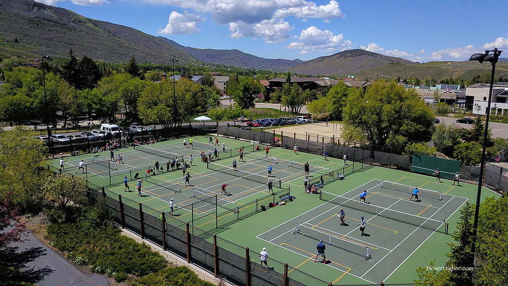 Many people playing pickleball on Memorial Day 2021 at City Park tennis court in Park City, Utah UT
