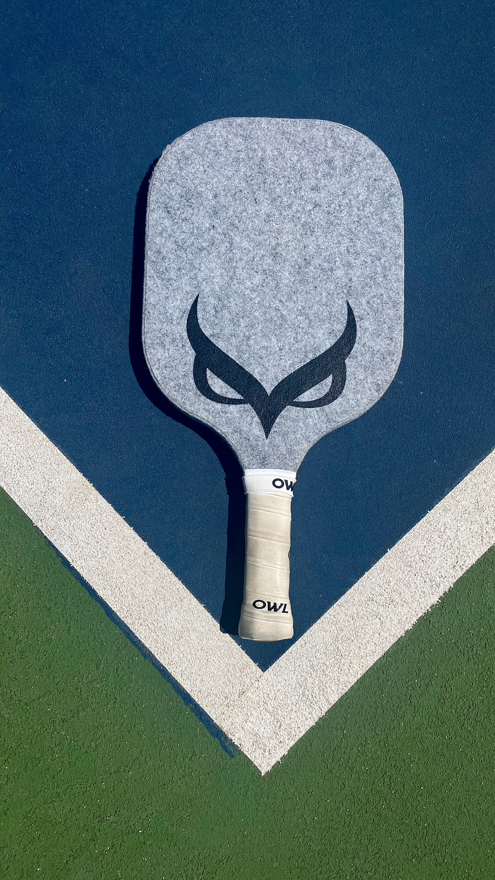 Owl Pickleball Paddle on a court