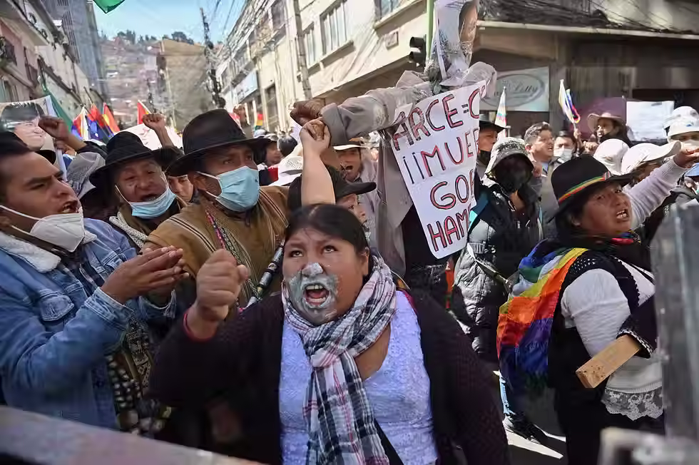 An Aymara woman uses bicarbonate on her face to protect herself against the effects of teargas as supporters of Evo Morales protest in support of his candidacy in La Paz last month. Photograph: Claudia Morales/Reuters