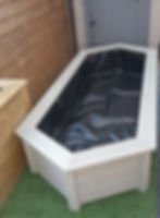 large elongated hexagonal garden pond with bench top
