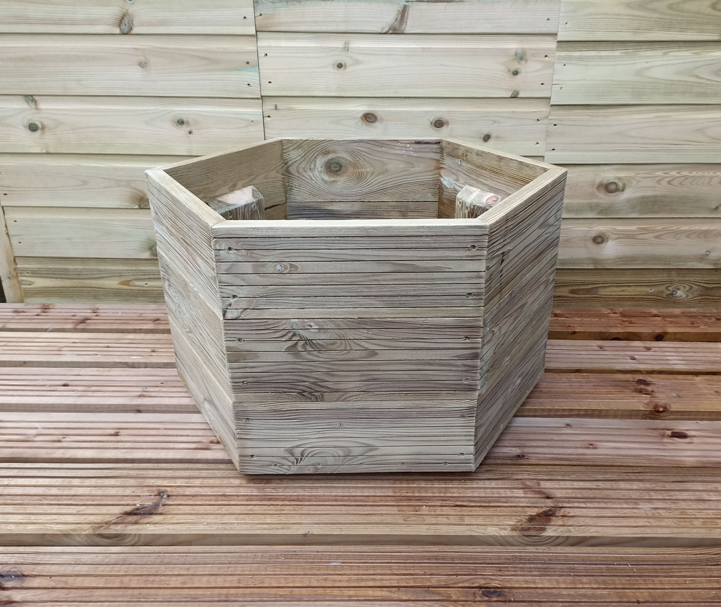 simple hexagonal wooden planter natural finish