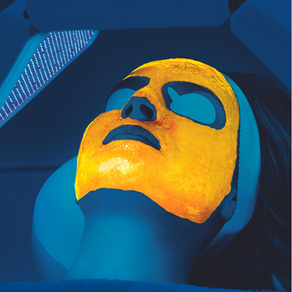 Client receiving Lumixa fluorescent light energy treatment under blue LED light at SANA Skin Clinic, Berwick
