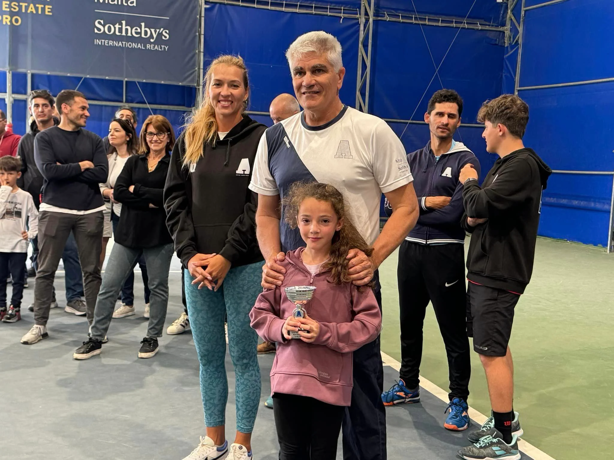 Tennis kid with trophy