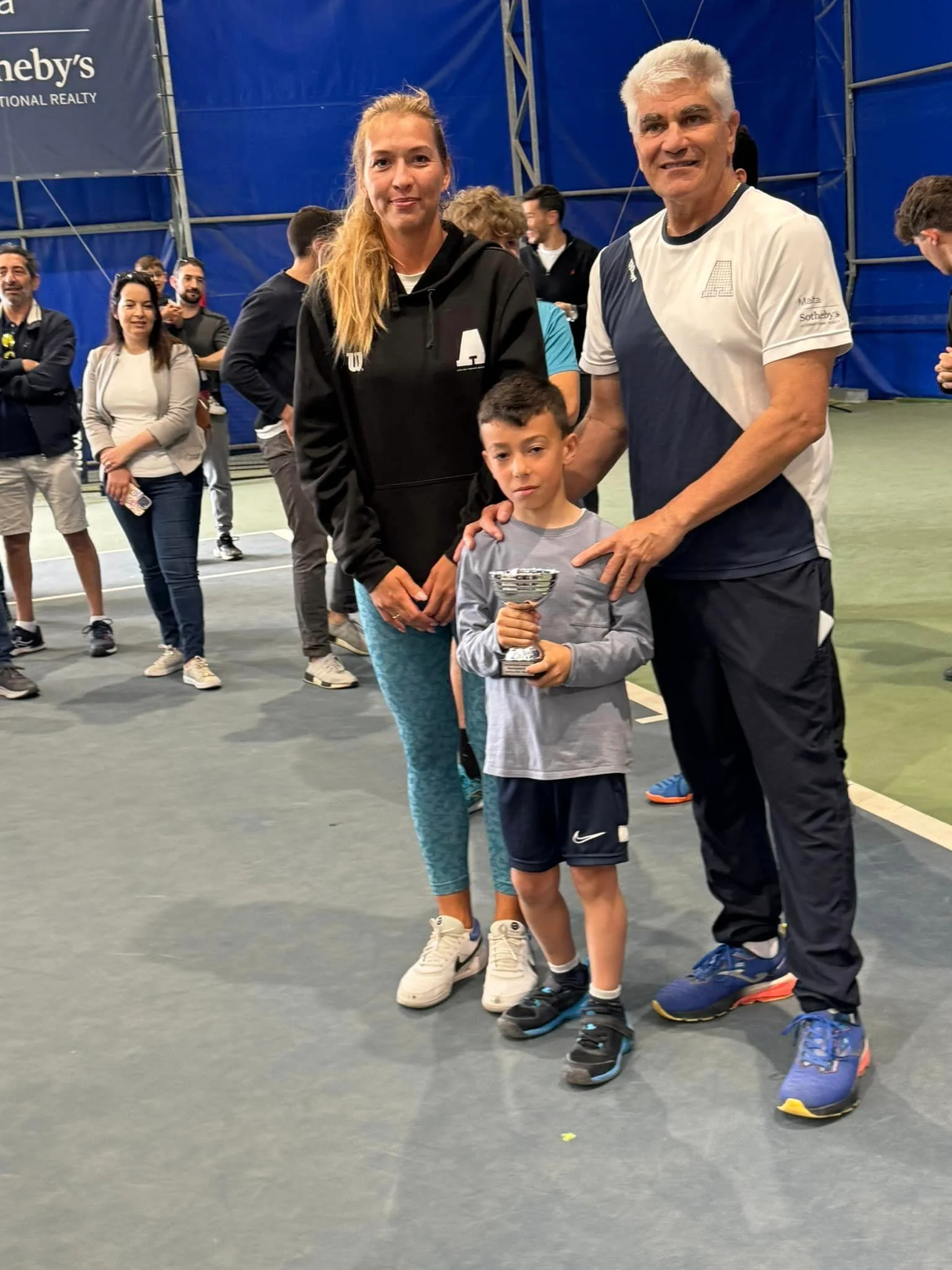 Tennis kid with trophy