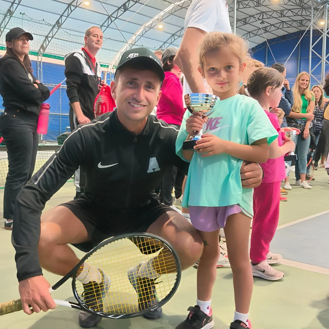 Tennis kid with coach