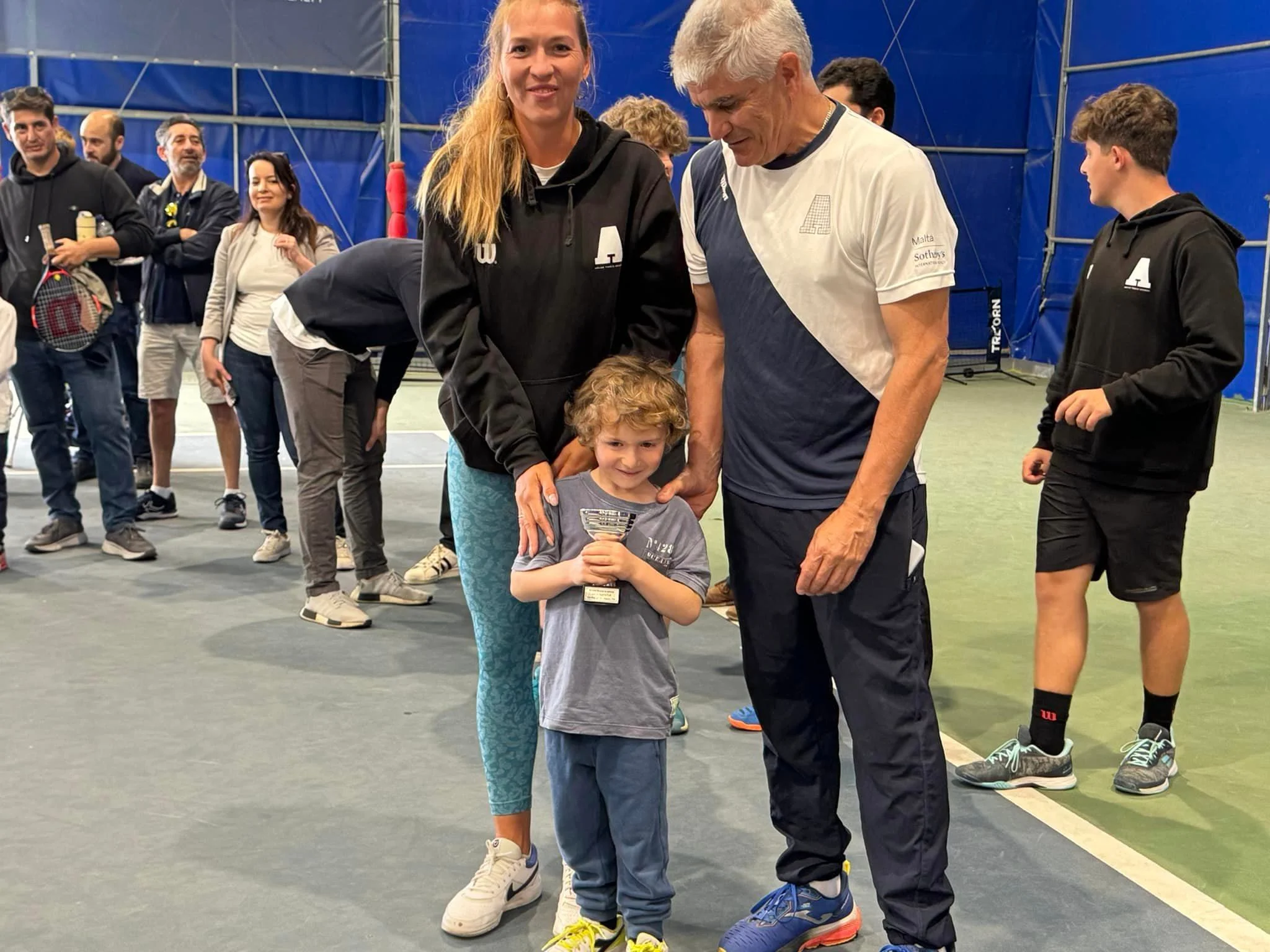 Tennis kid with trophy