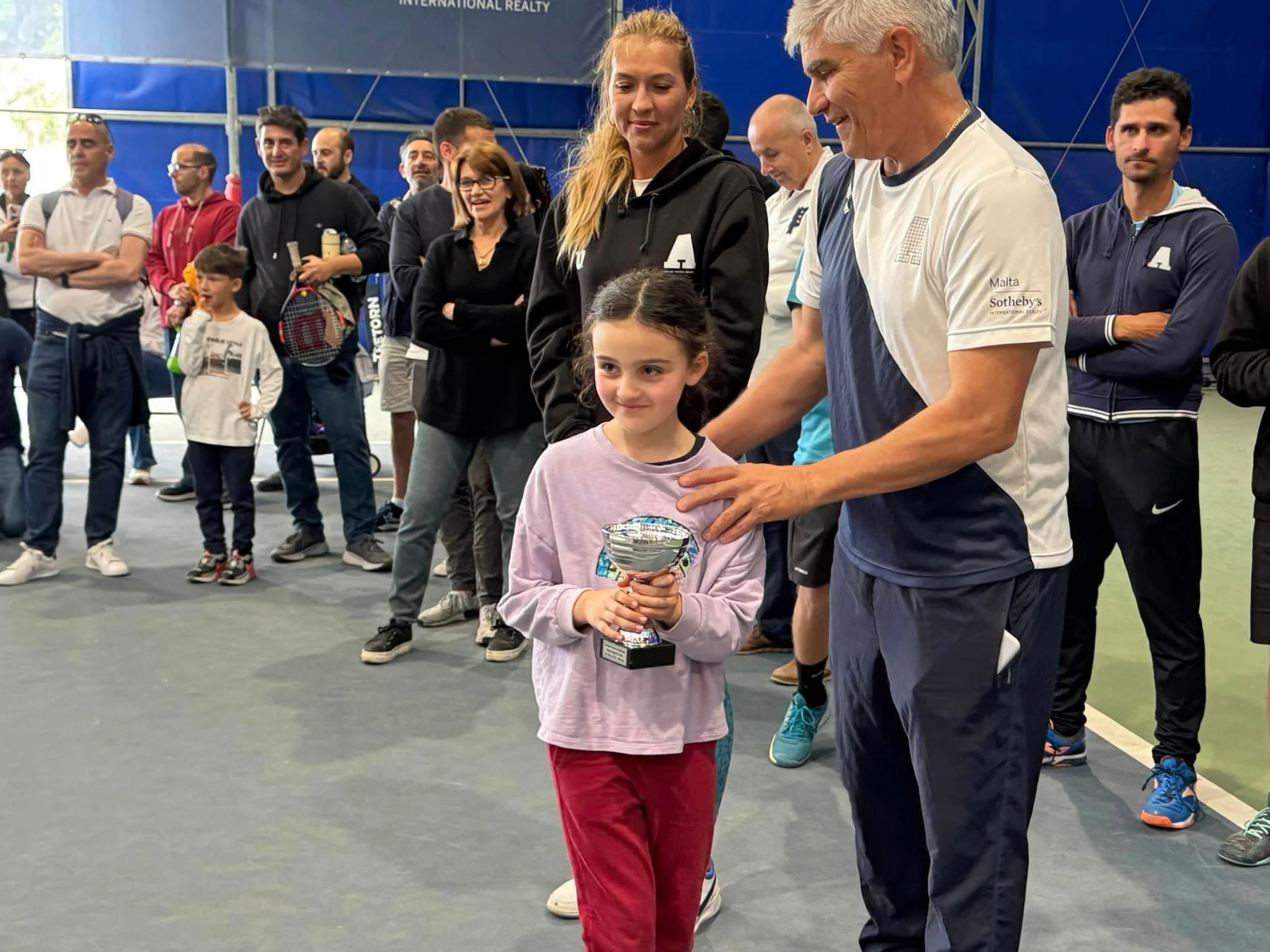 Tennis kid with trophy