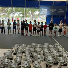 Tennis kids with trophys