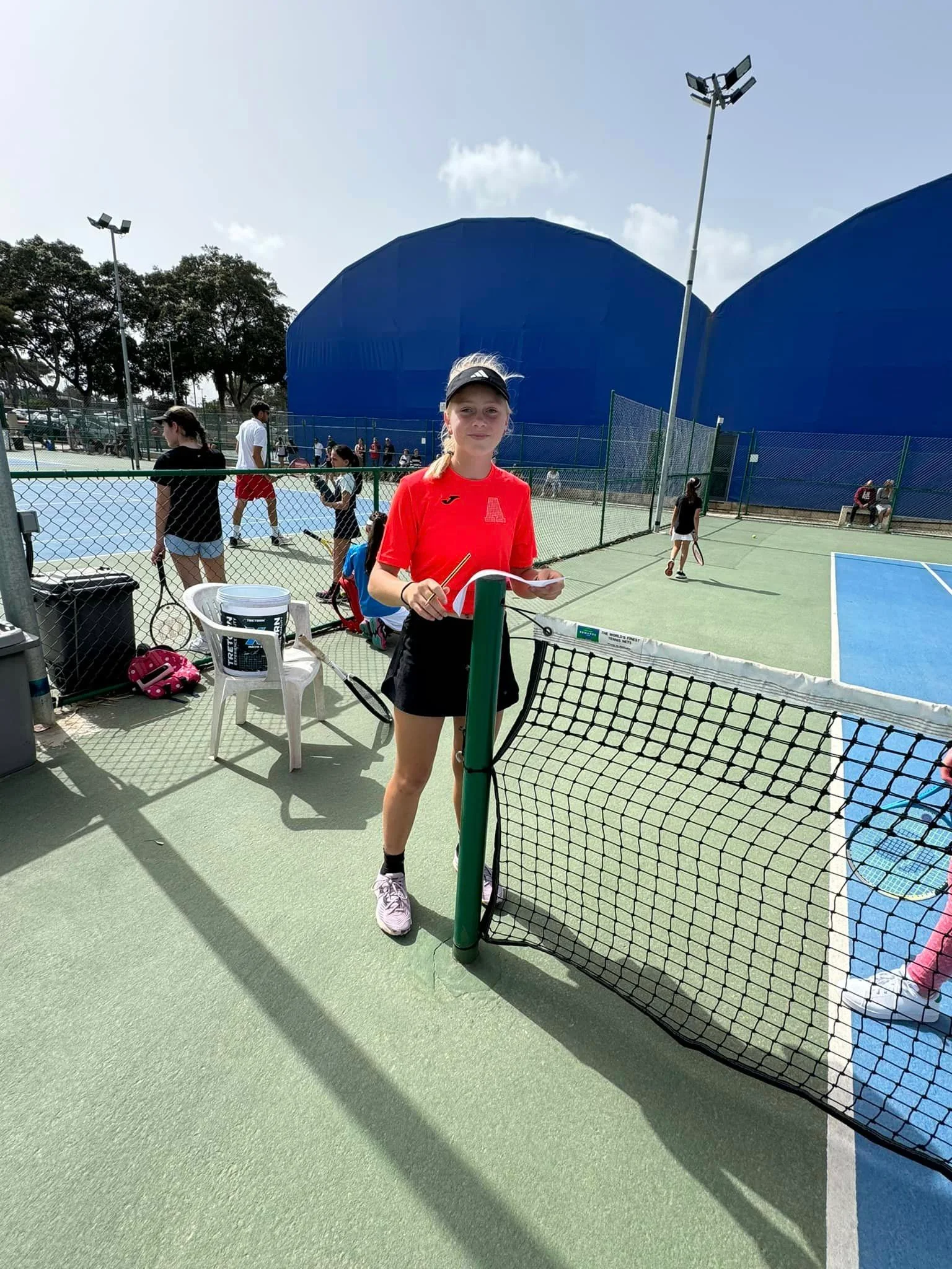 Tennis coach on court