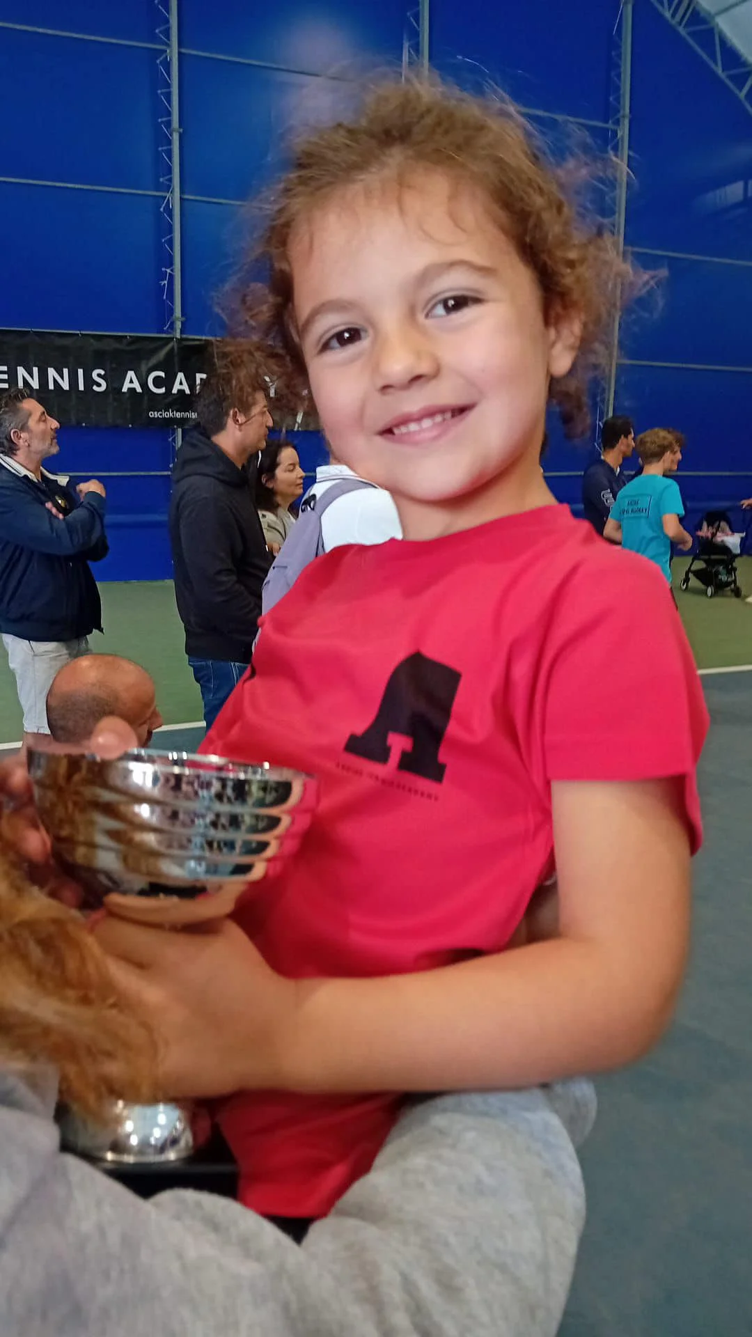 Tennis kid with trophy