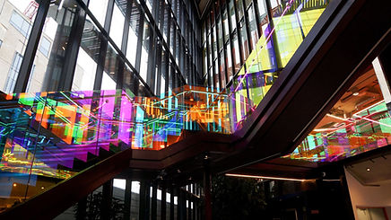 dichroic effect window film applied to glass staircase