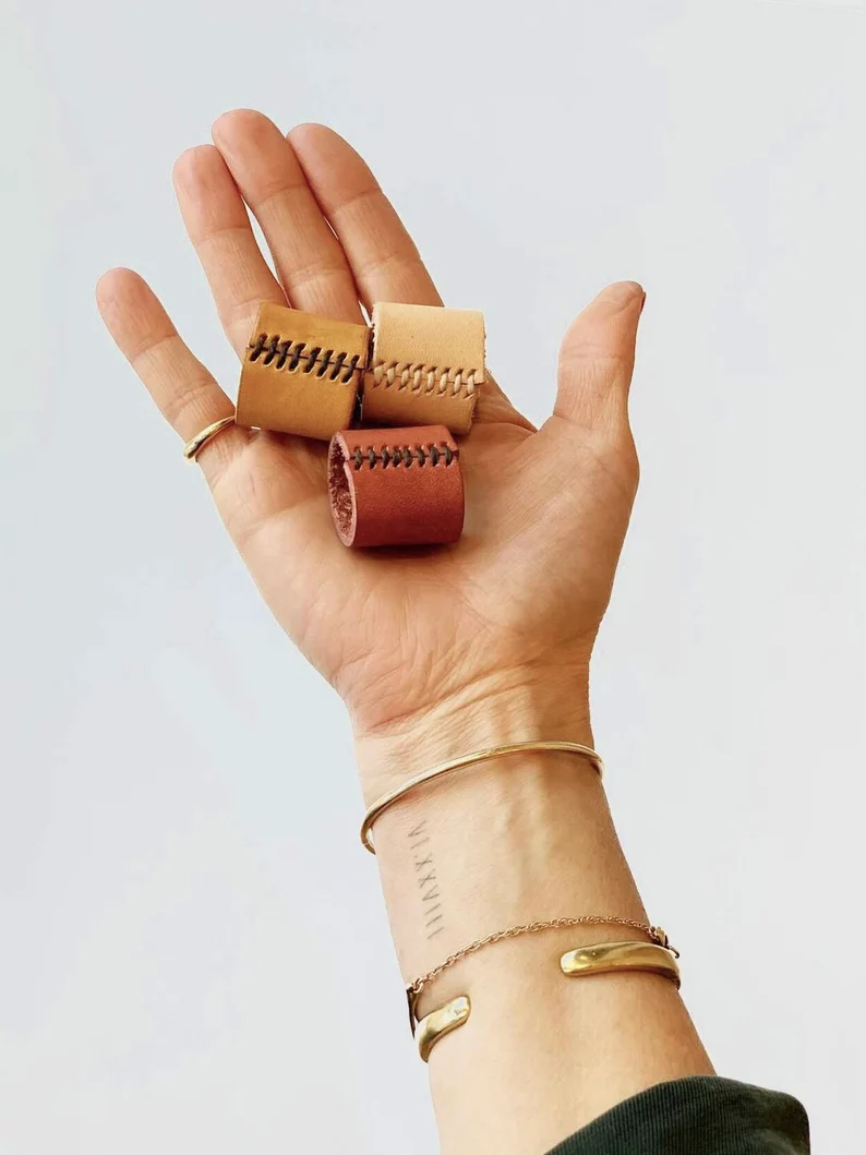 hand holding leather bandana rings