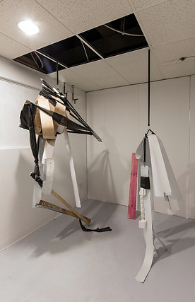 Sculpture made with bent wood and plaster, with rubber bungees, & elastic.