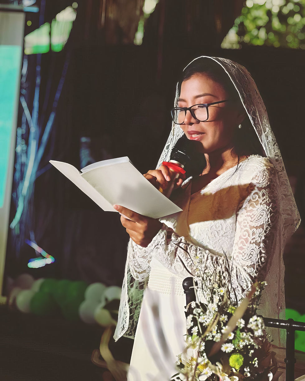 Faye reading her commitment in front of her family, friends, and community.