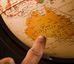 person-s-finger-pointing-australia-country-globe_23-2147837092.jpg