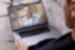 Person talking in a laptop