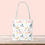 Thumbnail: ASL "I Love You" with Books, Flowers, Stars Pattern | Tote Bag