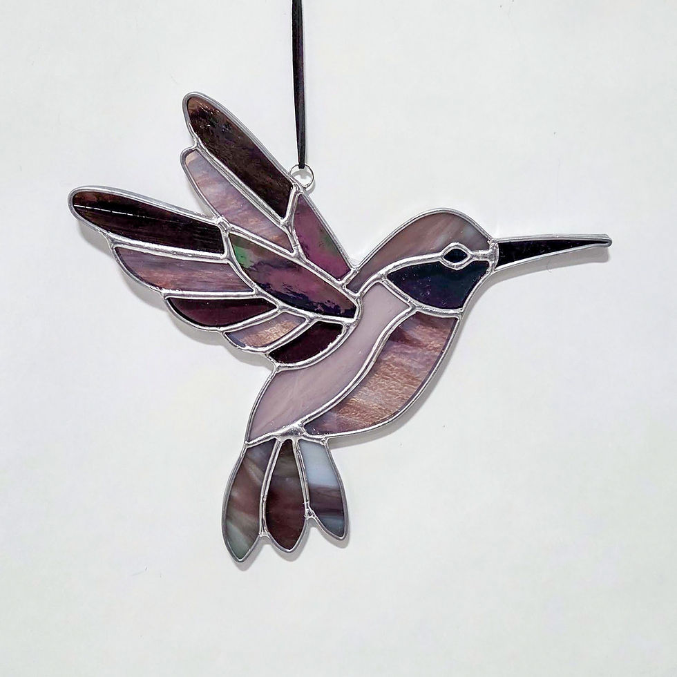 Thumbnail: Handmade stained glass hummingbird in flight with iridescent shifting colors and a sparkling dichroic glass eye, hanging in a