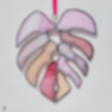 Large stained glass monstera leaf in pink hues, available in two unique leaf shapes